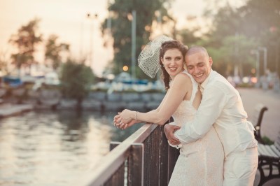 bride & groom smiling by the canal